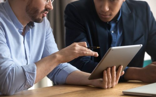 a person training another person on how to use Accounting softwares
