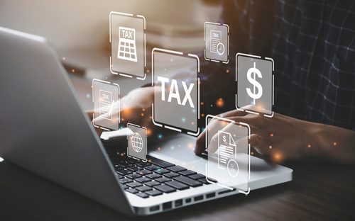 laptop with tax and dollar sign popped up