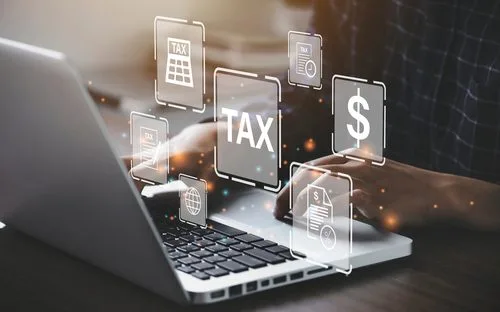 laptop with tax and dollar sign popped up